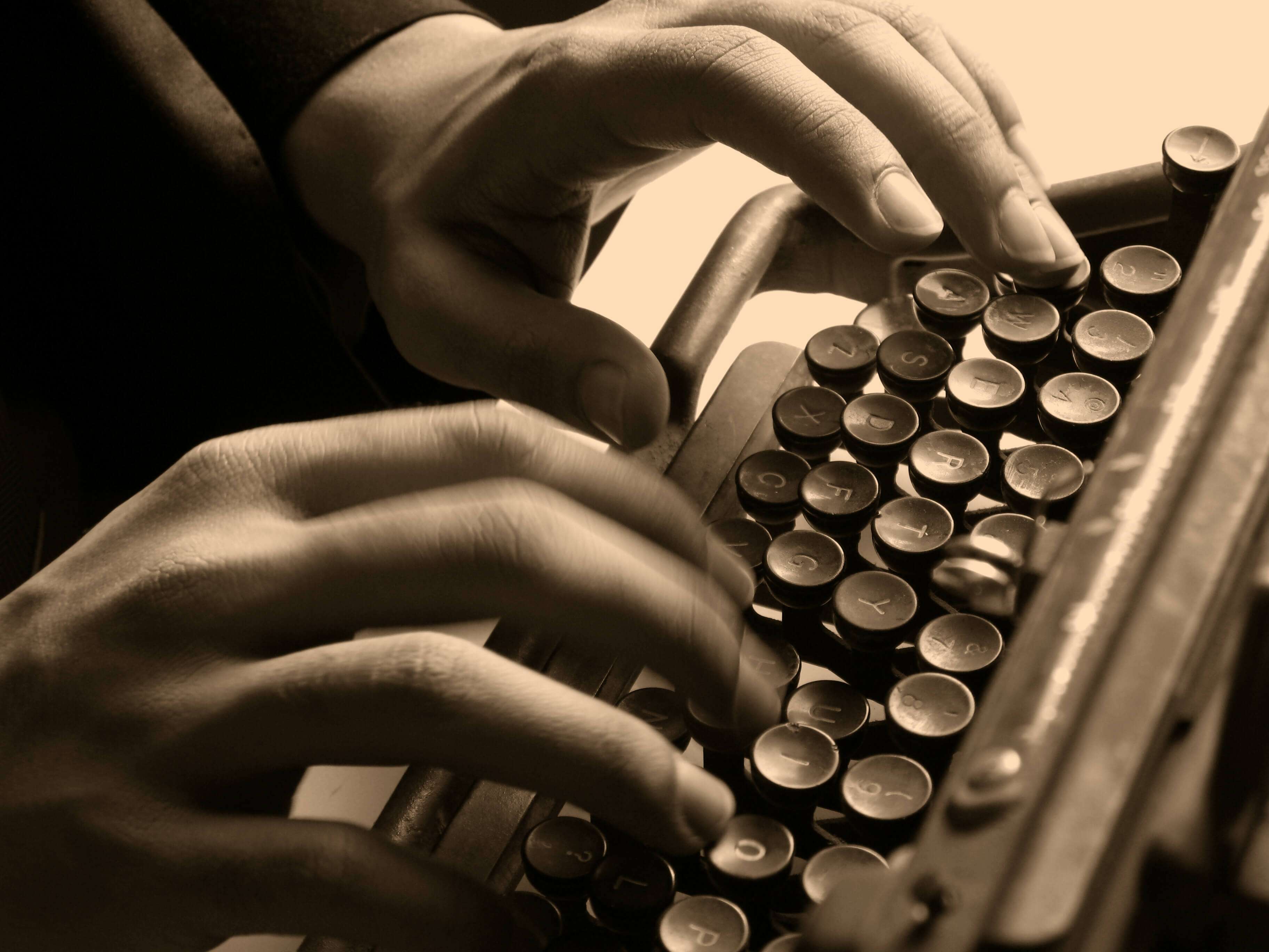 Typing a critical thinking paper on a typewriter